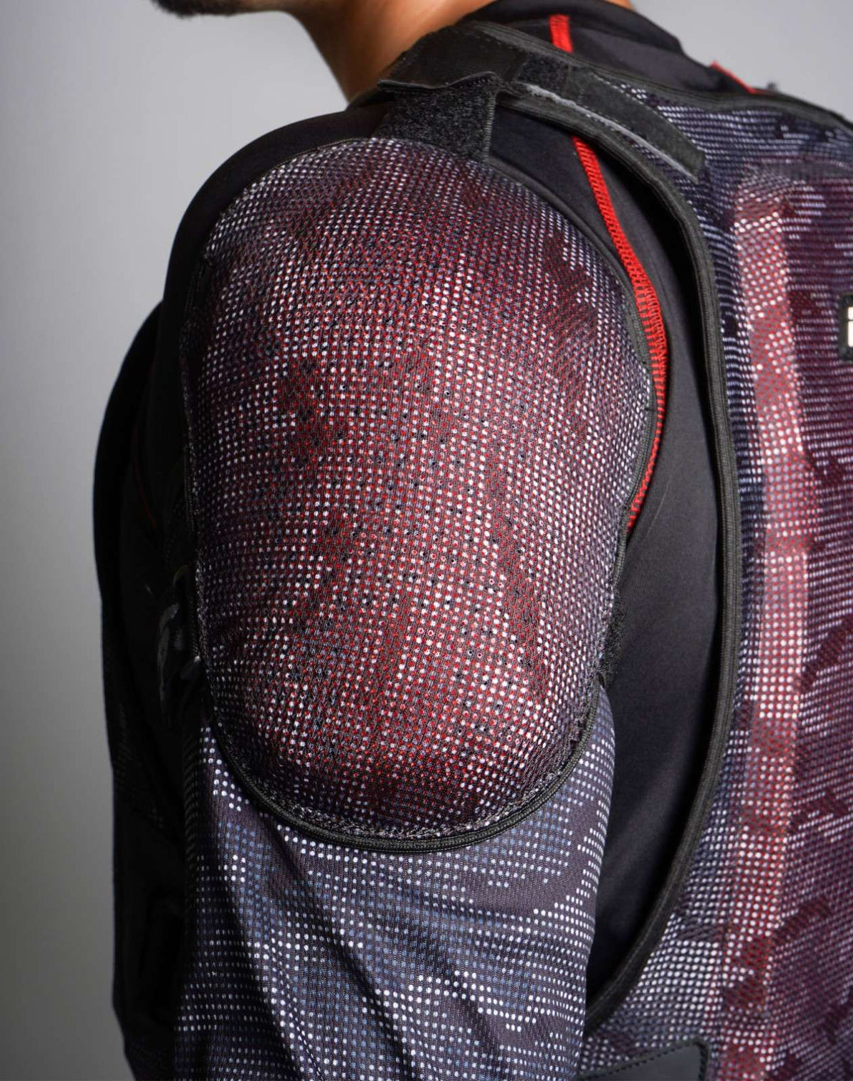 Close-up of CE Level 2 shoulder protector on DSG Bionic ADV Jacket, worn by rider