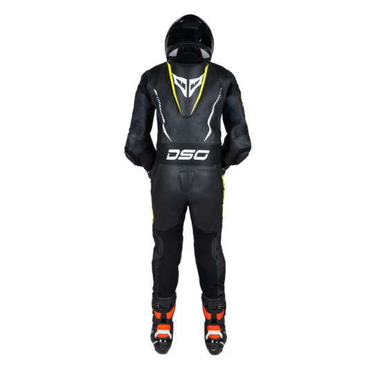 Rear view of a rider wearing the DSG GP Racing Leather Suit in black and yellow fluo