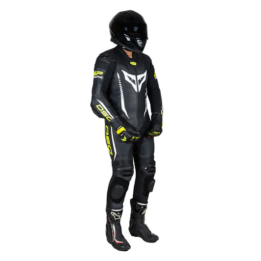 Side view of a rider wearing the DSG GP Racing Leather Suit in black and yellow fluo